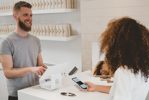 A customer is interacting with saleswomen