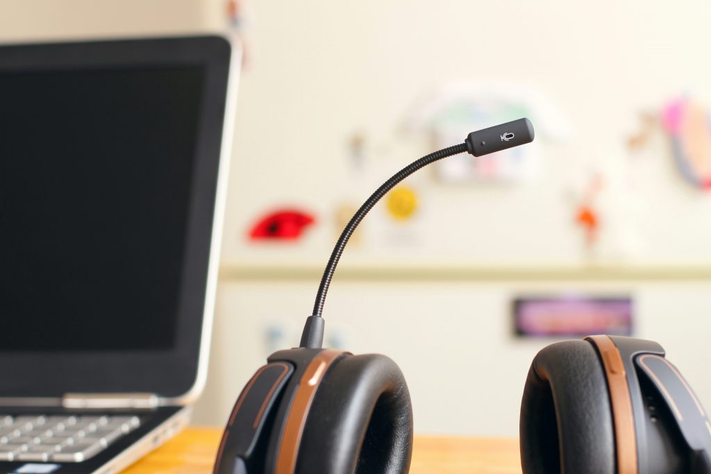 headphones and laptop on table